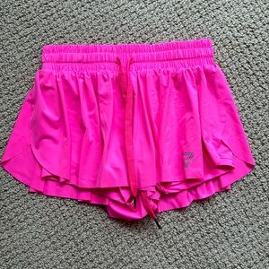 Bright pink Keiki Kona flowy shorts - built in shorts